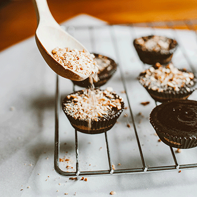 chocolate cupcake with a peanuts on it